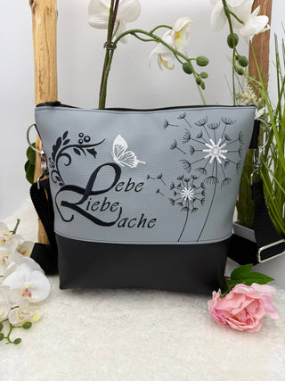 Lebe Liebe Lache mit zwei Pusteblumen